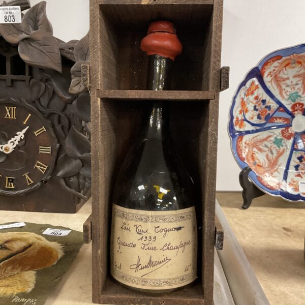 Empty 1939 cognac bottle in wooden box, vintage collectible.
