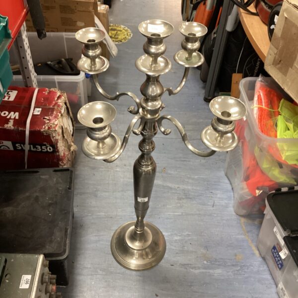 Ornate aluminium five-head candle stick for table centrepiece.