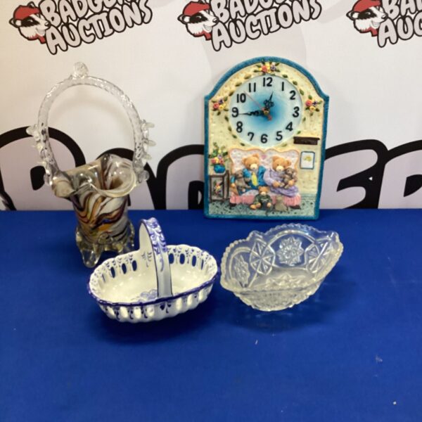 Vintage basket collection featuring glass, ceramic, and a teddy bear clock.