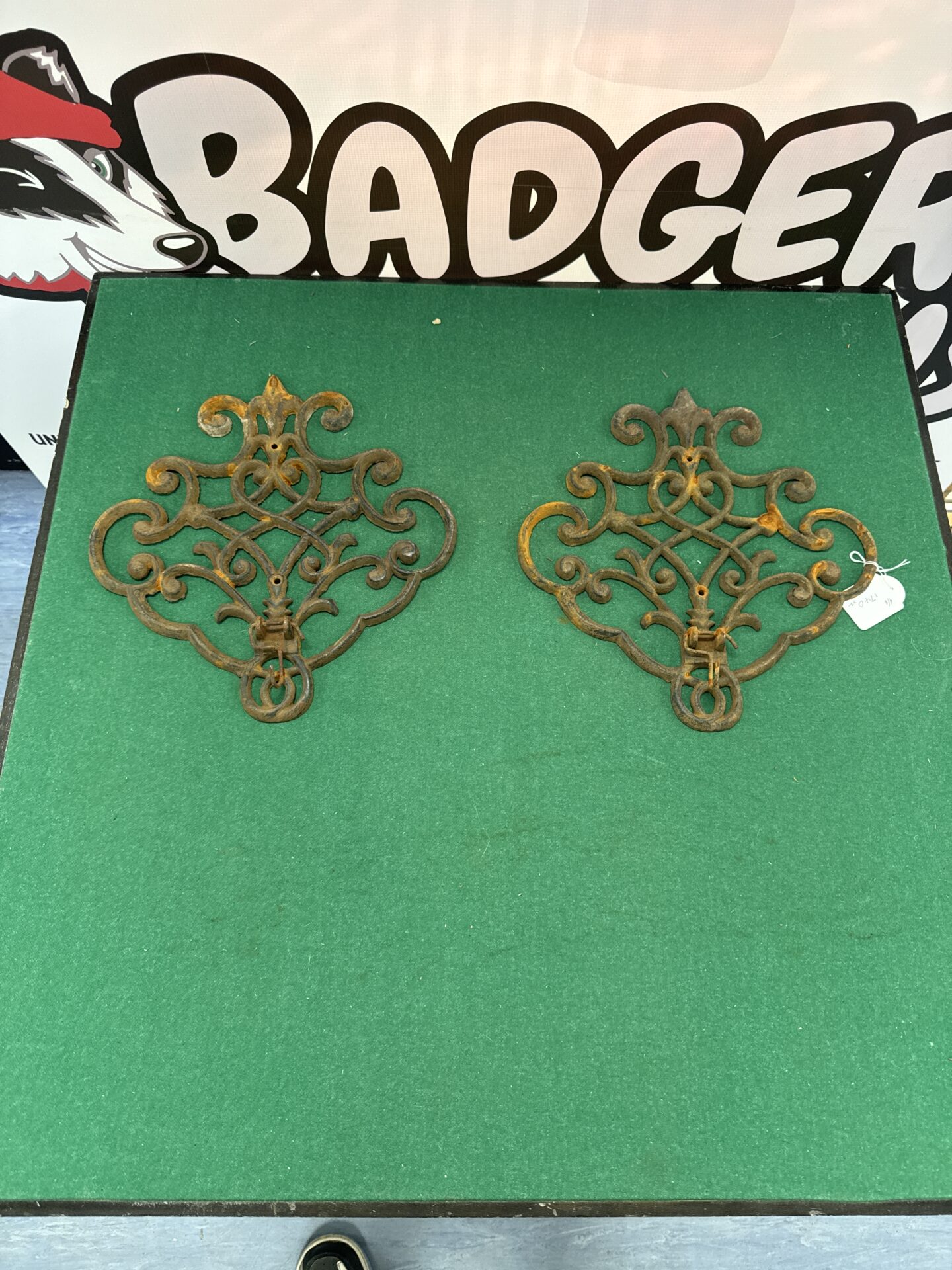 1055 Two vintage wrought iron wall plaques with hanging hooks