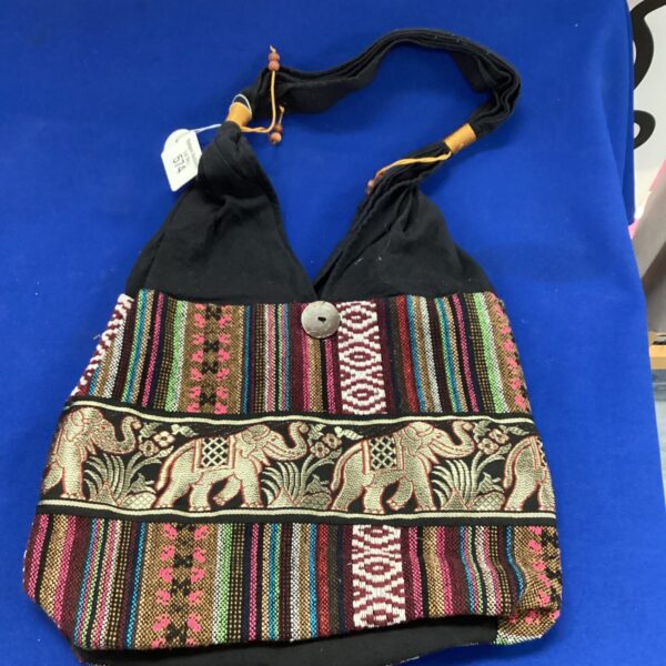 Colourful vintage elephant shoulder bag with woven textile design.