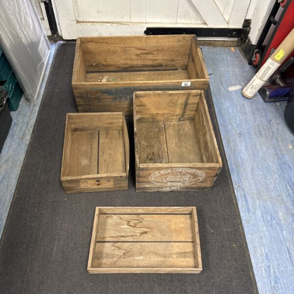 Lot of four vintage wooden crates for storage and display.