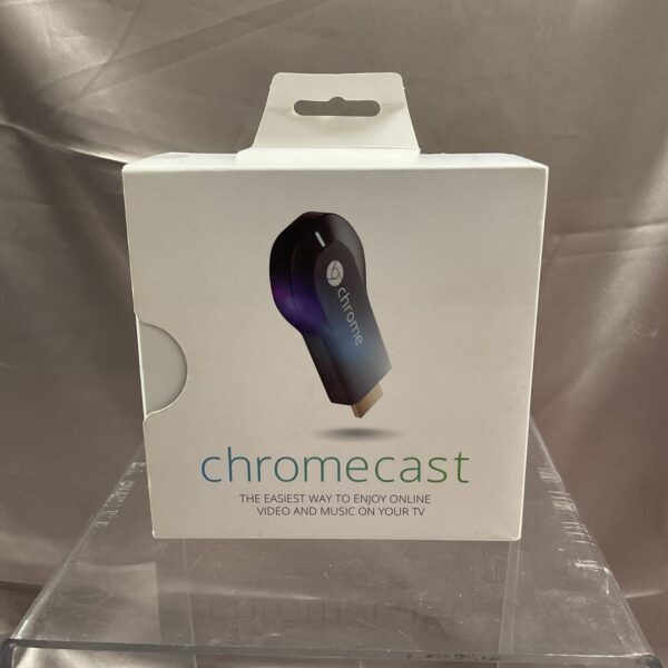 Front view of Chromecast streaming device in its original box.