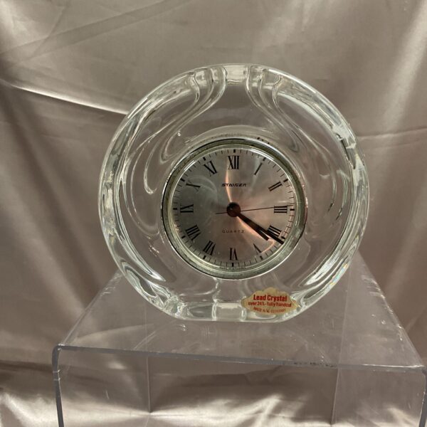 Elegant Staiger lead crystal mantle clock with clear face.