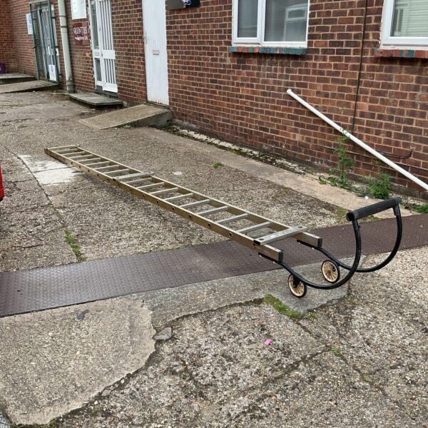Large builders roof ladder with wheels for easy manoeuvrability.