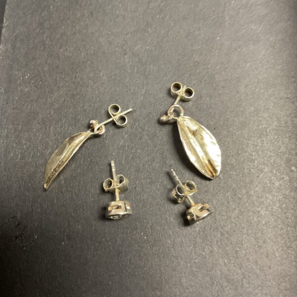 Vintage silver drop earrings with a delicate, flowing design.