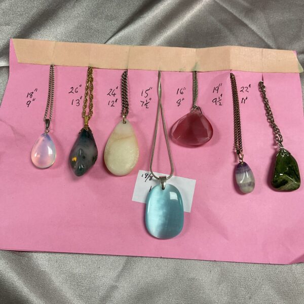 Lot of seven colourful stone pendant necklaces.