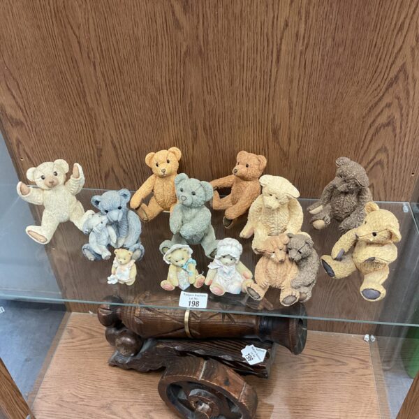 Sharratt & Simpson teddy bear collection displayed on a shelf.