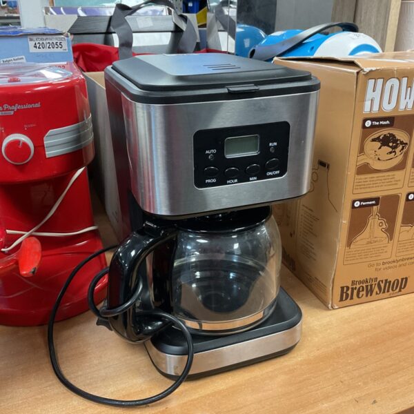 Black and chrome vintage coffee maker, retro kitchen appliance.