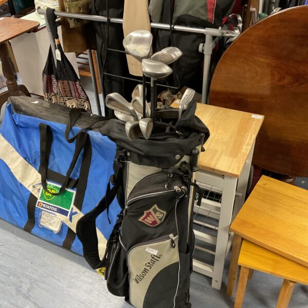 Vintage MacGregor golf clubs in a Wilson golf bag.