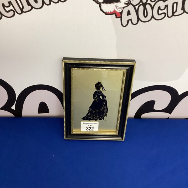 Antique hand painted glass profile of a lady.