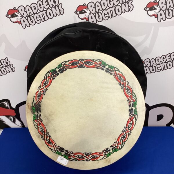 Traditional Irish bodhran drum with protective case for folk music.