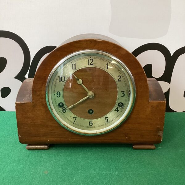 Front view of a vintage art deco mantle clock.