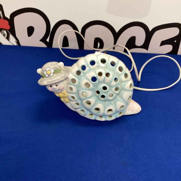 Vintage Piggery Pottery snail lamp with pierced shell design.