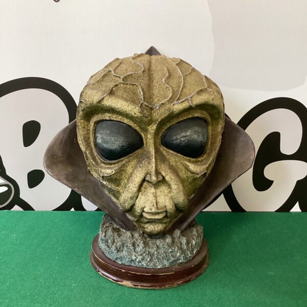 Detailed fibreglass alien bust sculpture for collectors.