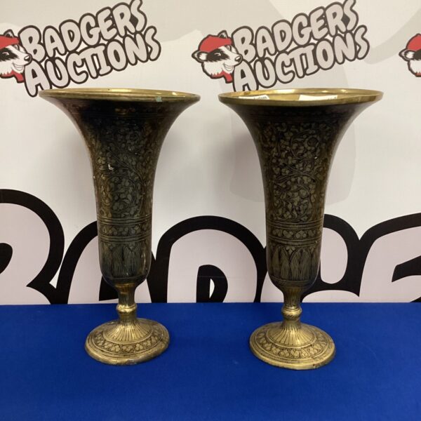 Intricate engraved Indian brass vases, a decorative pair.