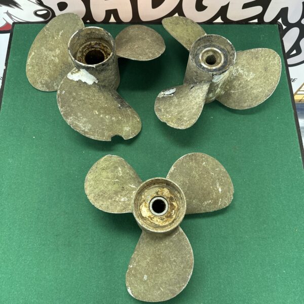 Vintage three-bladed boat propeller for marine use.