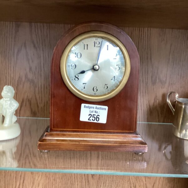 Vintage retro wooden mantle clock on display.