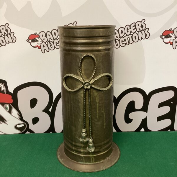 Antique brass umbrella stand, vintage hall decor.