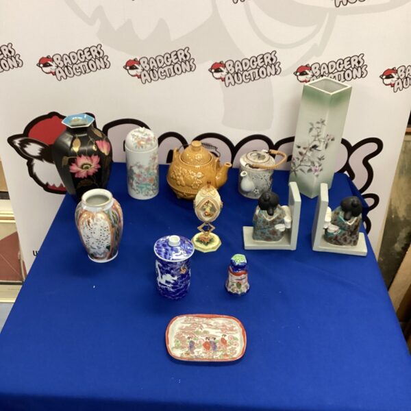 Assorted Chinese porcelain figurines and vases in a collectibles lot.