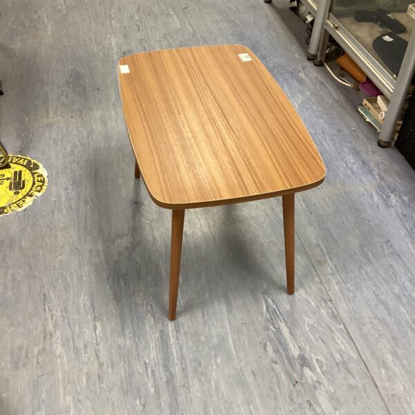 Vintage mid-century teak side table with tapered legs.