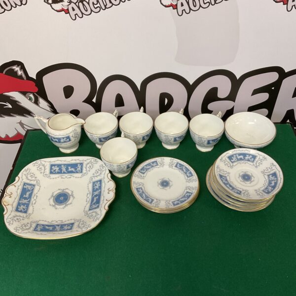 Vintage Coalport Revelry china teacups and saucers set on display.
