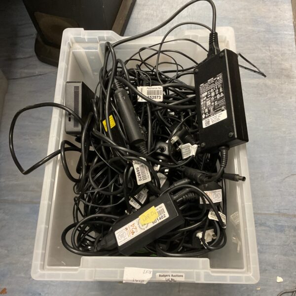 Mixed lot of laptop chargers and power supplies for various laptops.