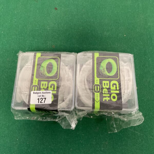 Two new glow in the dark nglo belts in packaging.