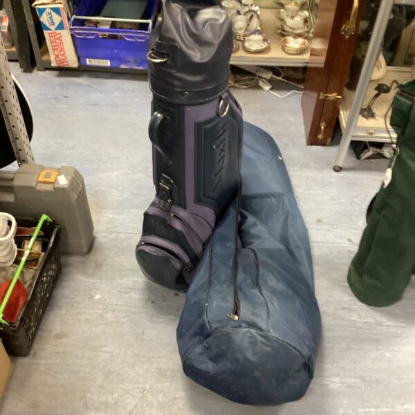 Navy blue golf travel bag with handle, ideal for protecting golf equipment.