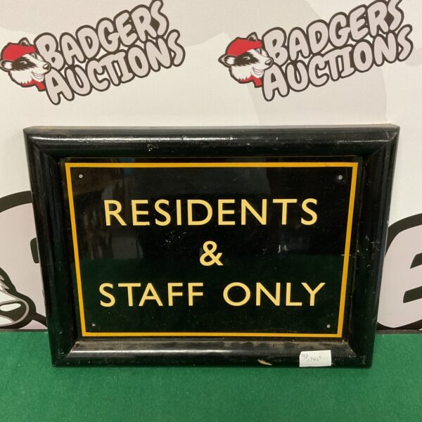 Vintage enamel sign reading "Residents & Staff" for workplace notice.