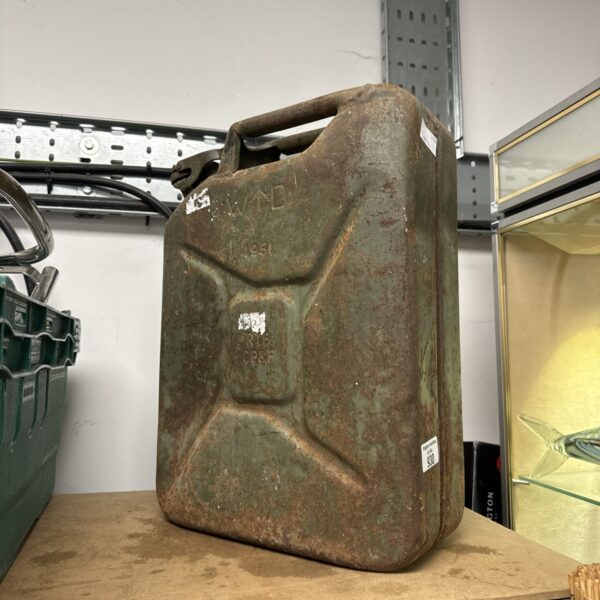Vintage 1951 military Jerry Can with wear and markings.