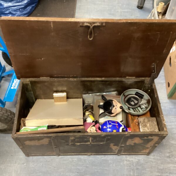 Vintage wooden chest filled with a mixed lot of collectibles.