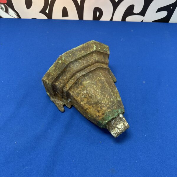 Antique cast iron hopper for rainwater drainage, showing age and patina.