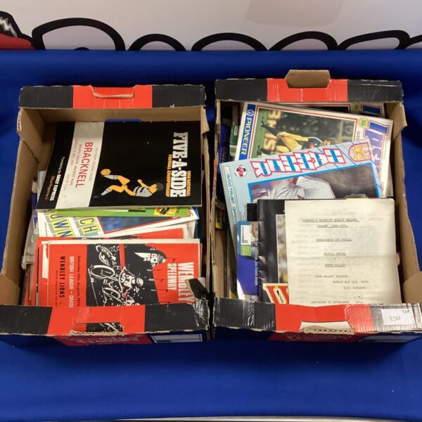 Vintage football programmes in two boxes, a collectible lot.