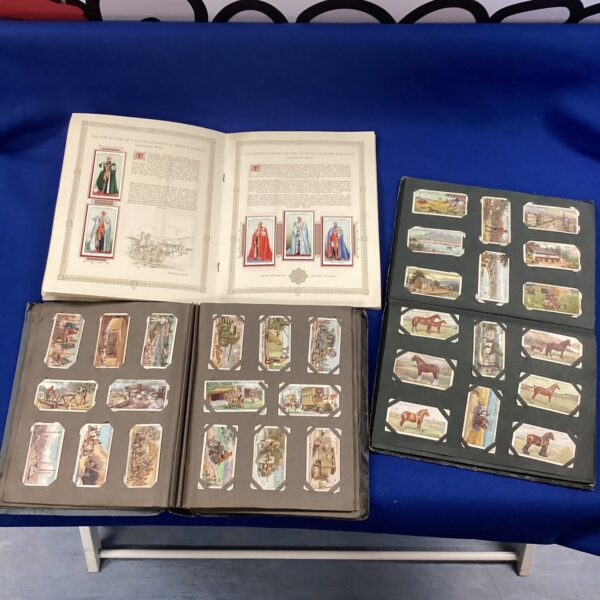 Vintage cigarette card albums including 1937 coronation album.
