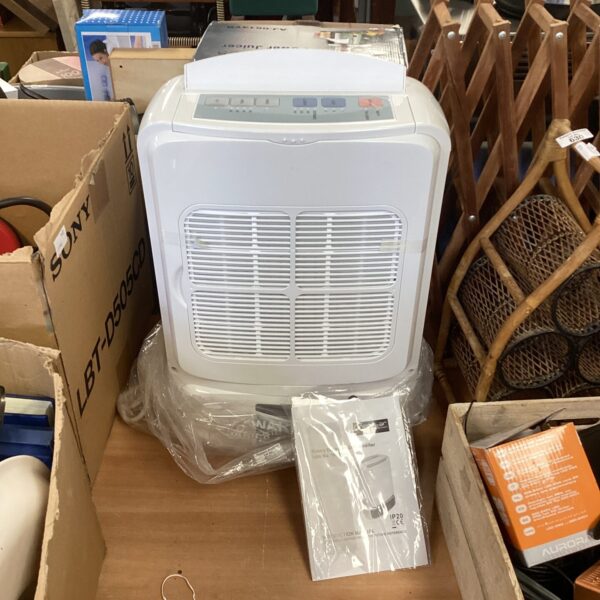 White Neostar dehumidifier in packaging, moisture removal appliance.