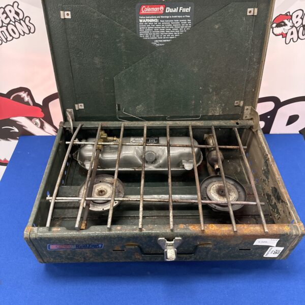 Vintage Coleman dual fuel twin burner camping stove in as-found condition.