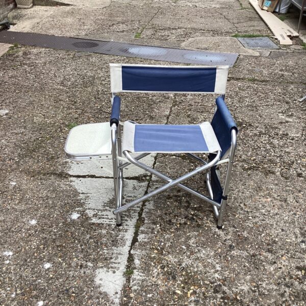 Vintage Quickseat folding chair with attached table for outdoor use.