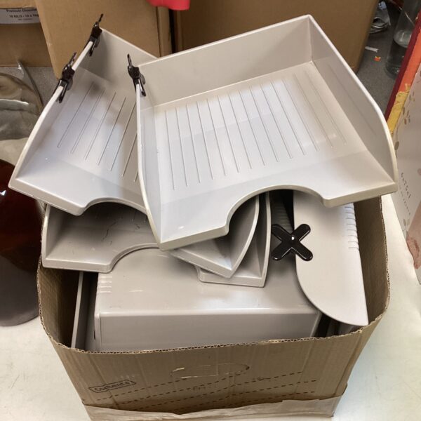 Lot of plastic desk file organisers for office or home use.