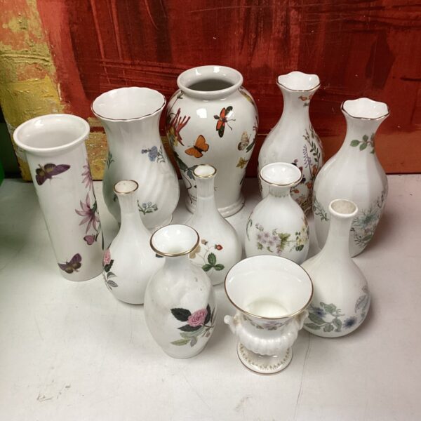 Collection of vintage Wedgwood and Aynsley porcelain vases with floral designs.