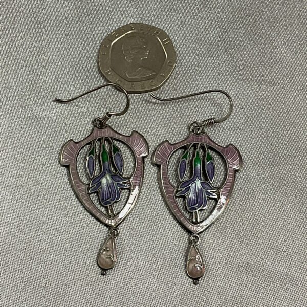 Vintage silver earrings with delicate floral enamel design.