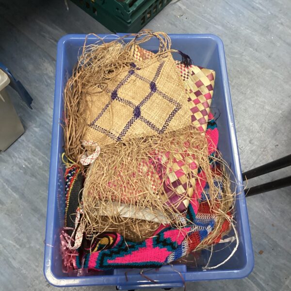 Lot of vintage Papua New Guinea woven blankets with varied textures.