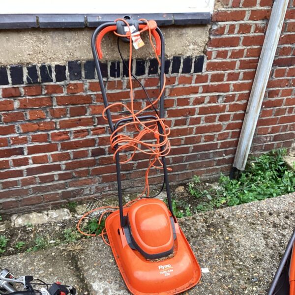 Flymo Turbo Lite electric lawnmower in a garden setting.