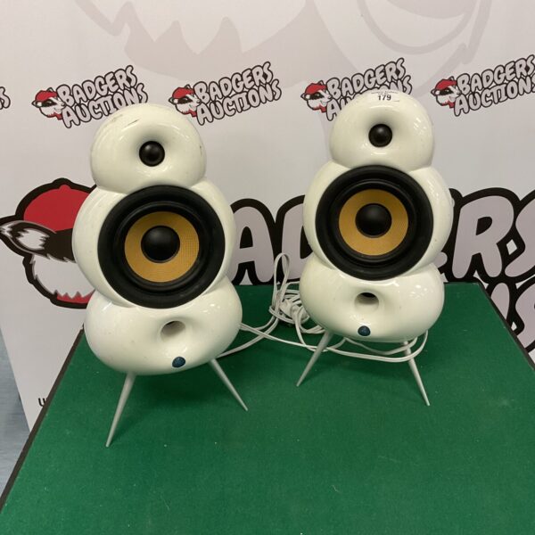 Pair of white Scandyna MiniPod speakers on display.