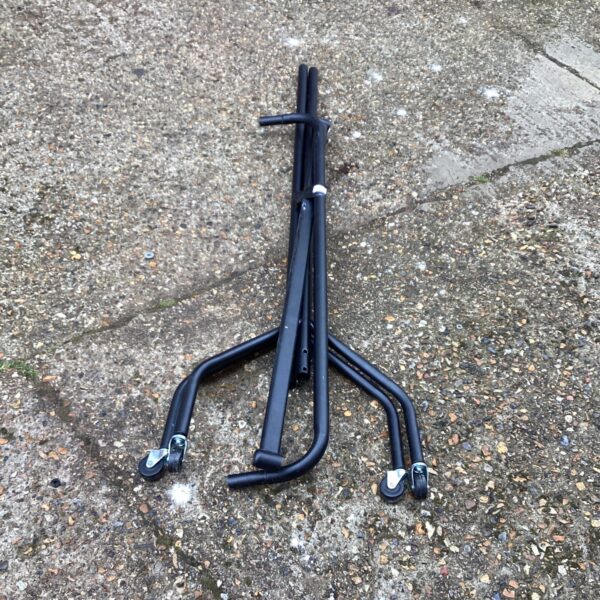 Black metal clothes rail for garment storage and display.