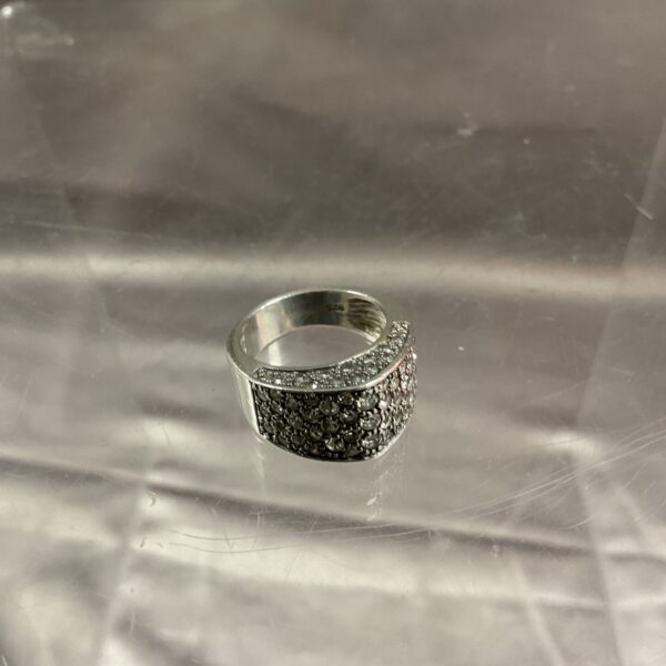Close-up of a silver marcasite ring with sparkling stones.