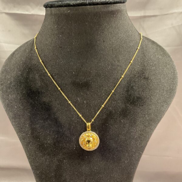 Vintage silver gilt lion head pendant necklace, detailed craftsmanship.