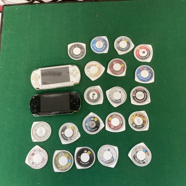 Sony PSP consoles and games lot for retro gaming collectors.