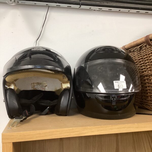 Pair of motorcycle crash helmets, Harley Davidson and AGV brands.