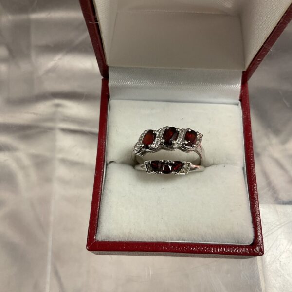 Silver ring with garnet and diamonds, size N.